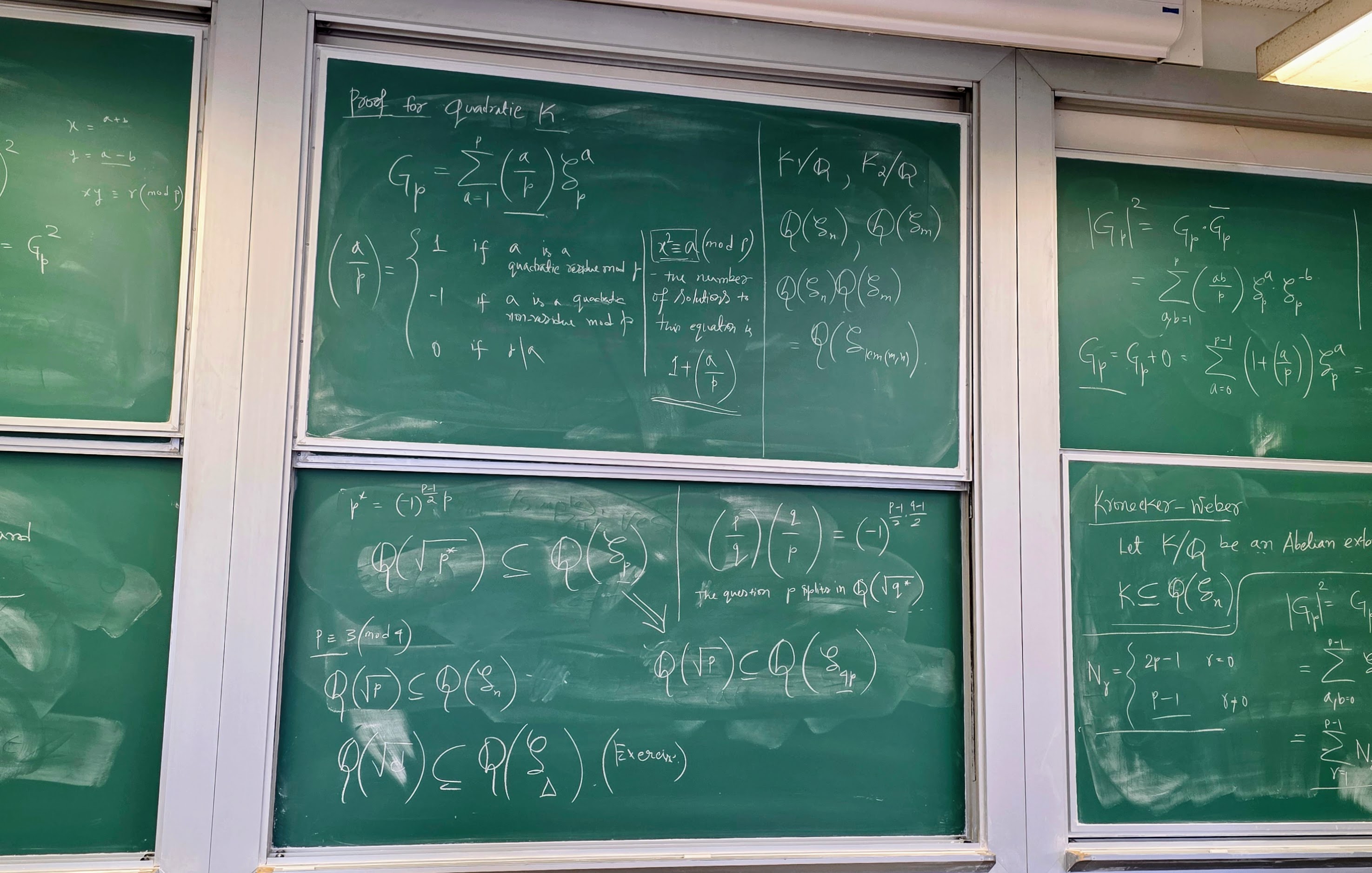 Classroom blackboards filled with mathematics notes and formulas.